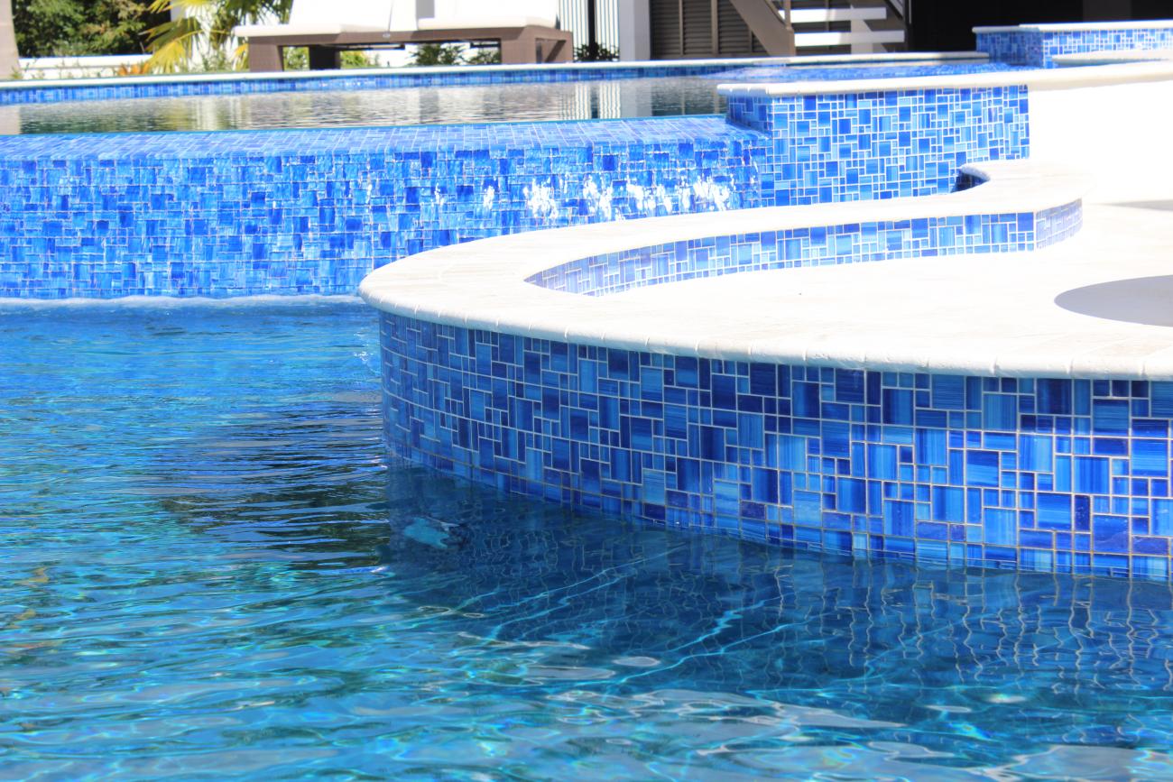 Luxury pool finished with brilliant blue glass tile